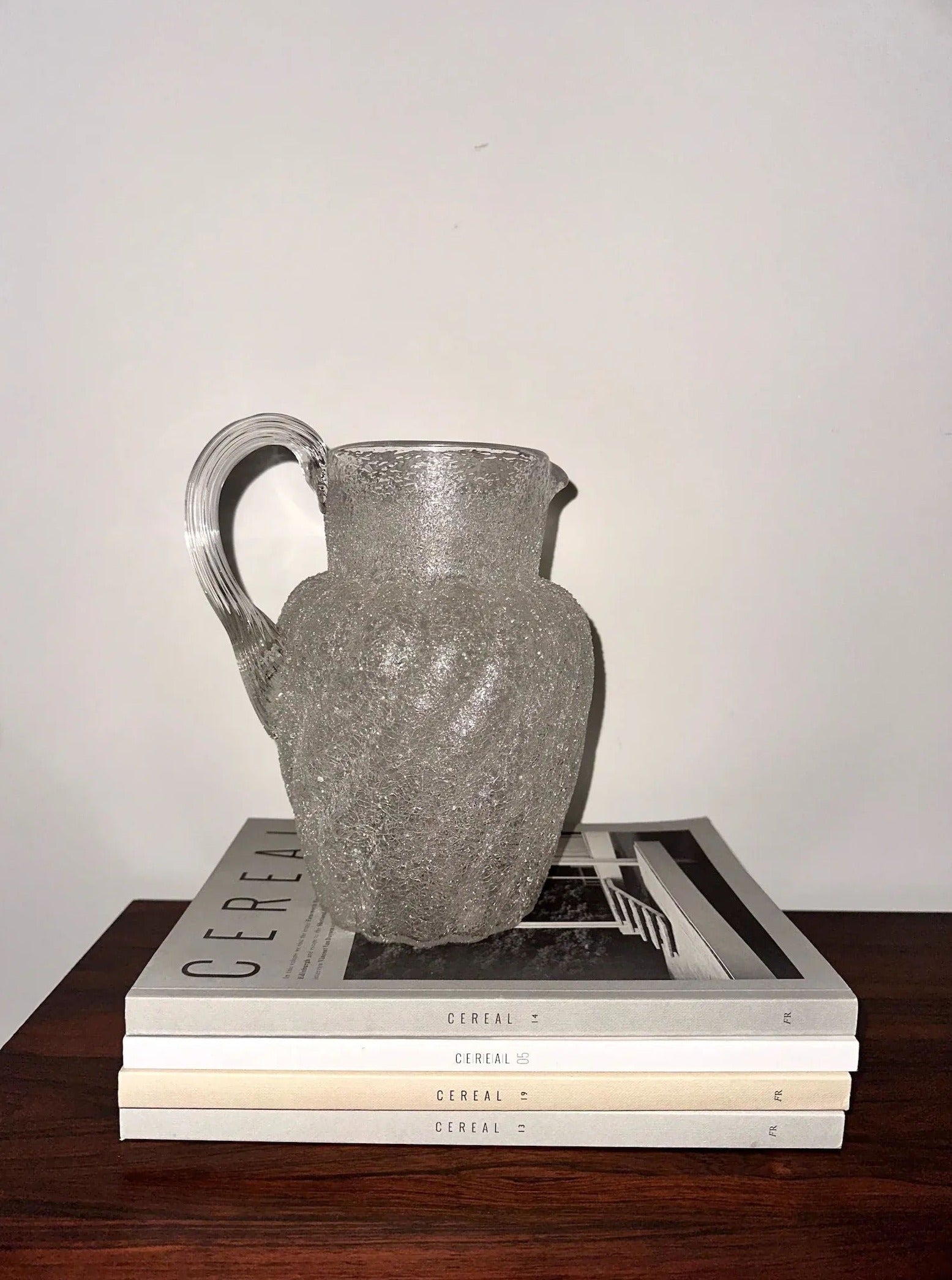 Beautiful crackled glass pitcher with elegant handle and intricate design