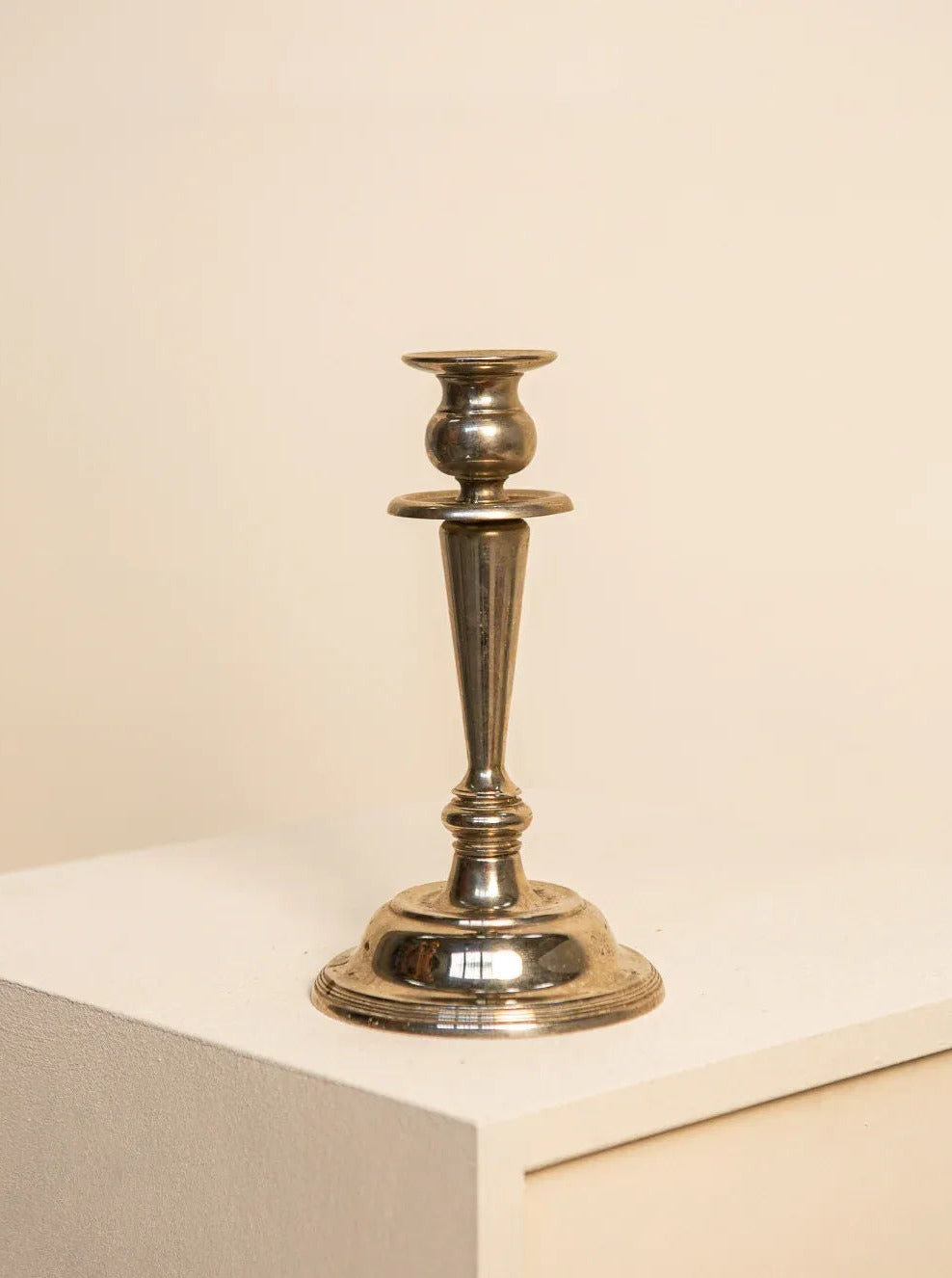 Handcrafted wrought iron candleholder in a spiral design with intricate details and a rustic finish