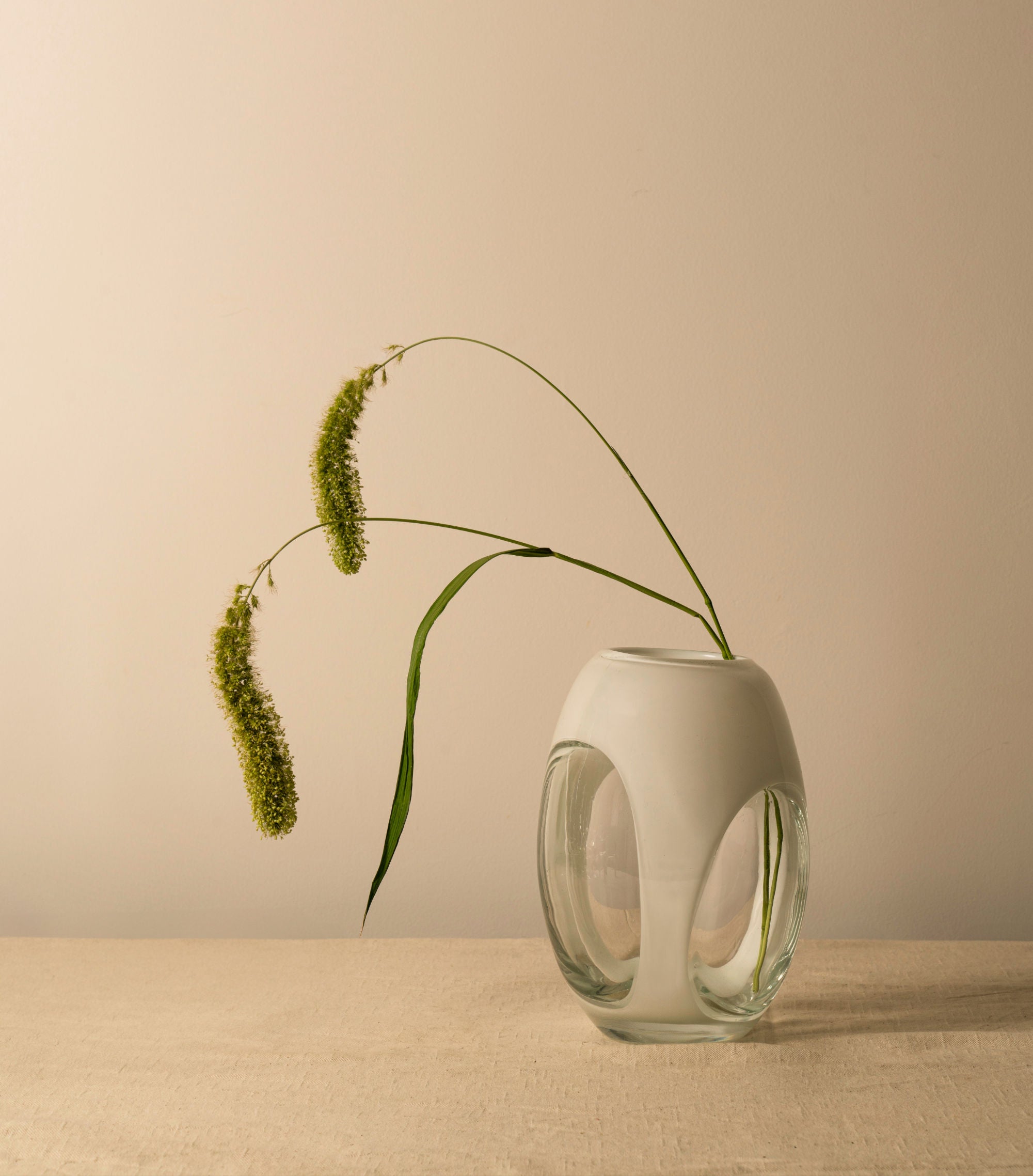 Modern metallic silver vase with sleek lines and futuristic design