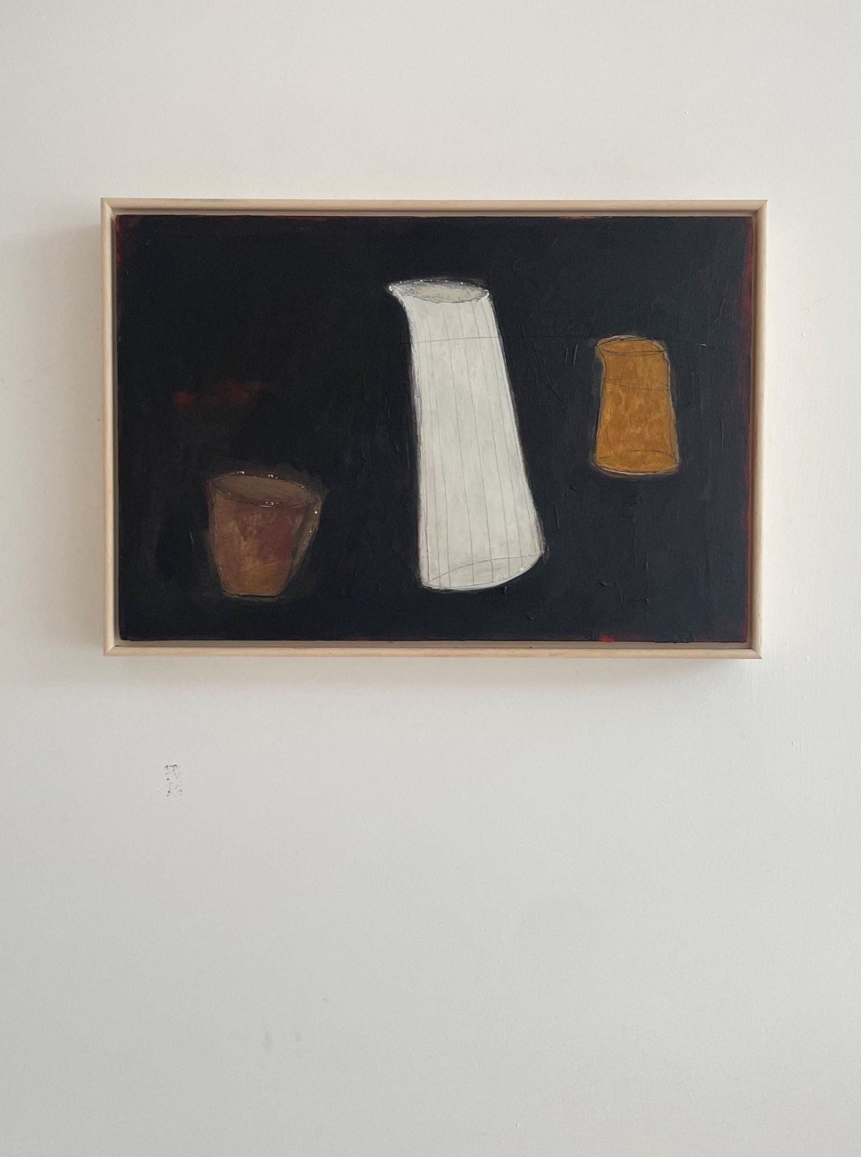 A painting featuring three abstract White Jug vase-like shapes in white, brown, and orange against a dark background, displayed in a light-colored frame on a white wall. This original painting is mounted on a crad.