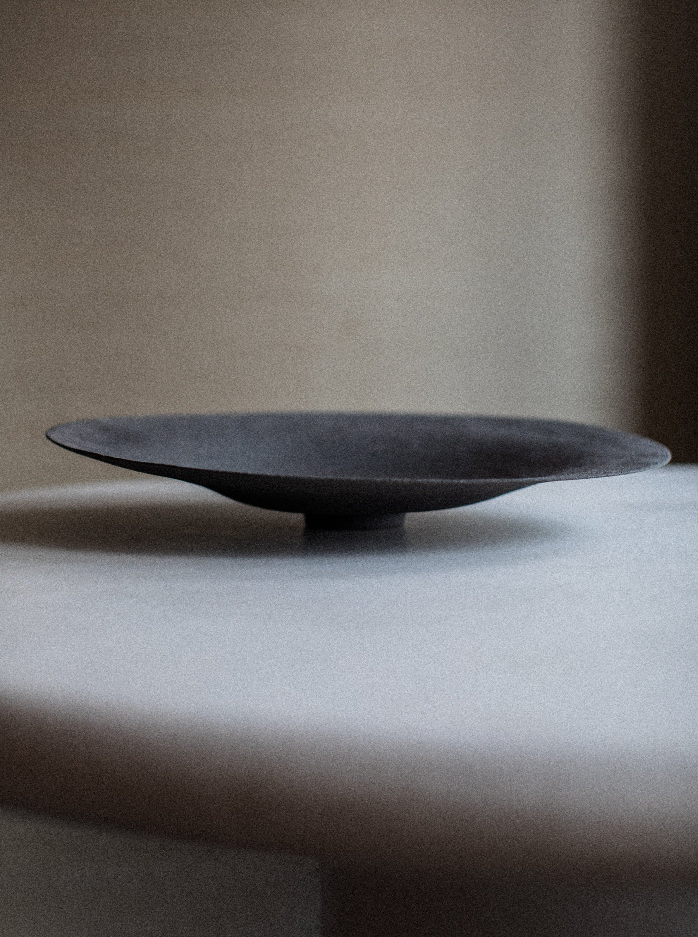 Sculptural Bowl crafted from white marble with intricate swirling patterns