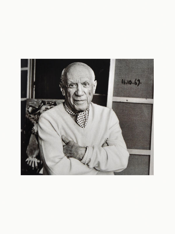  Lucien Clergue: The Intimate Picasso book open to a page featuring a photograph of Clergue and Picasso in a studio 