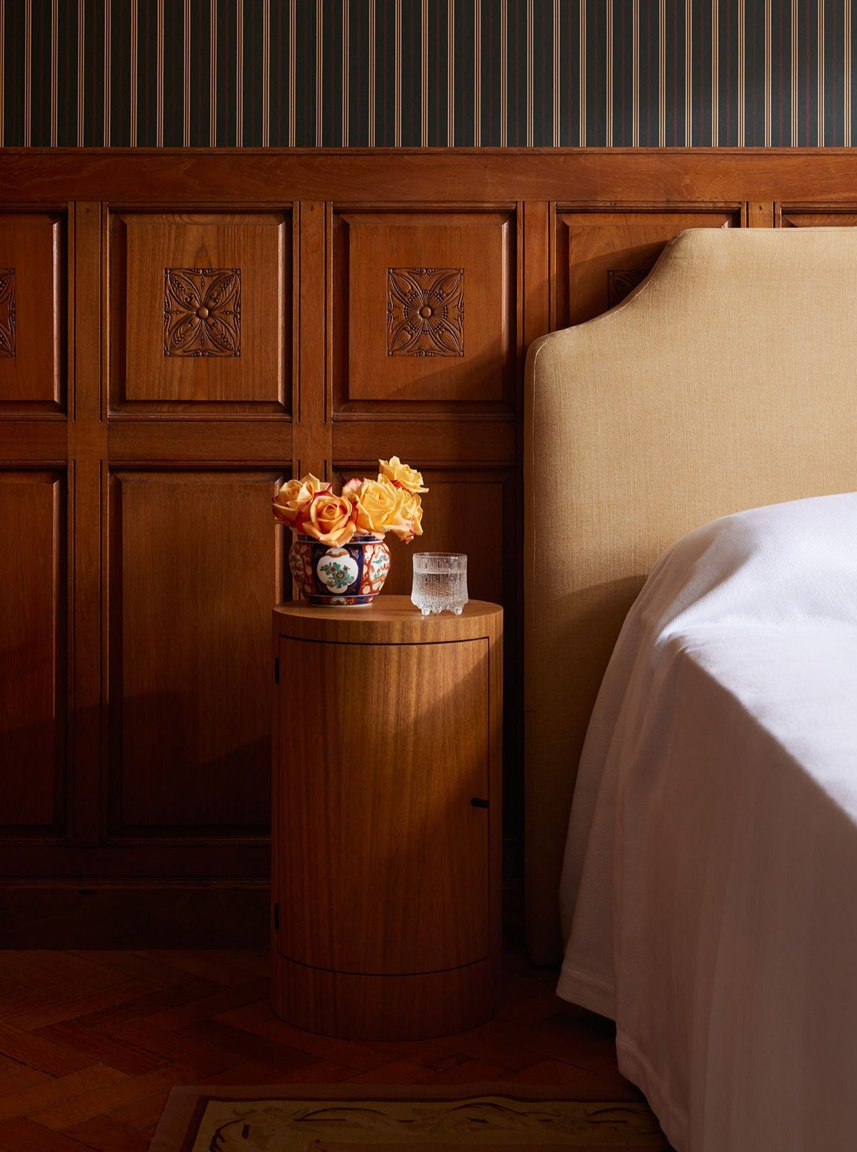 Pair of beautifully crafted constant nightstands in oiled iroko wood with sleek modern design
