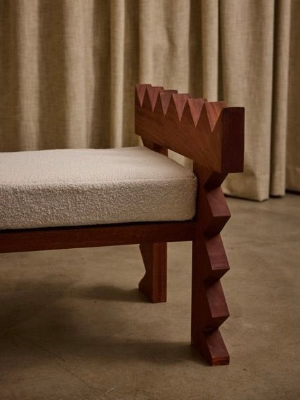 Wooden Bench from  by Ah Um Design Studio: a sculptural seating piece crafted from solid mahogany