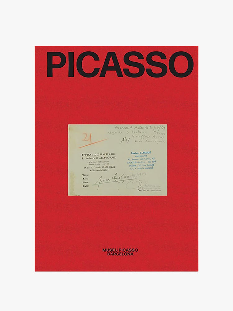A red poster with the text "PICASSO" in large black letters at the top, an image of a document with handwritten notes in the center, and "MUSEU PICASSO BARCELONA" in smaller black letters at the bottom.