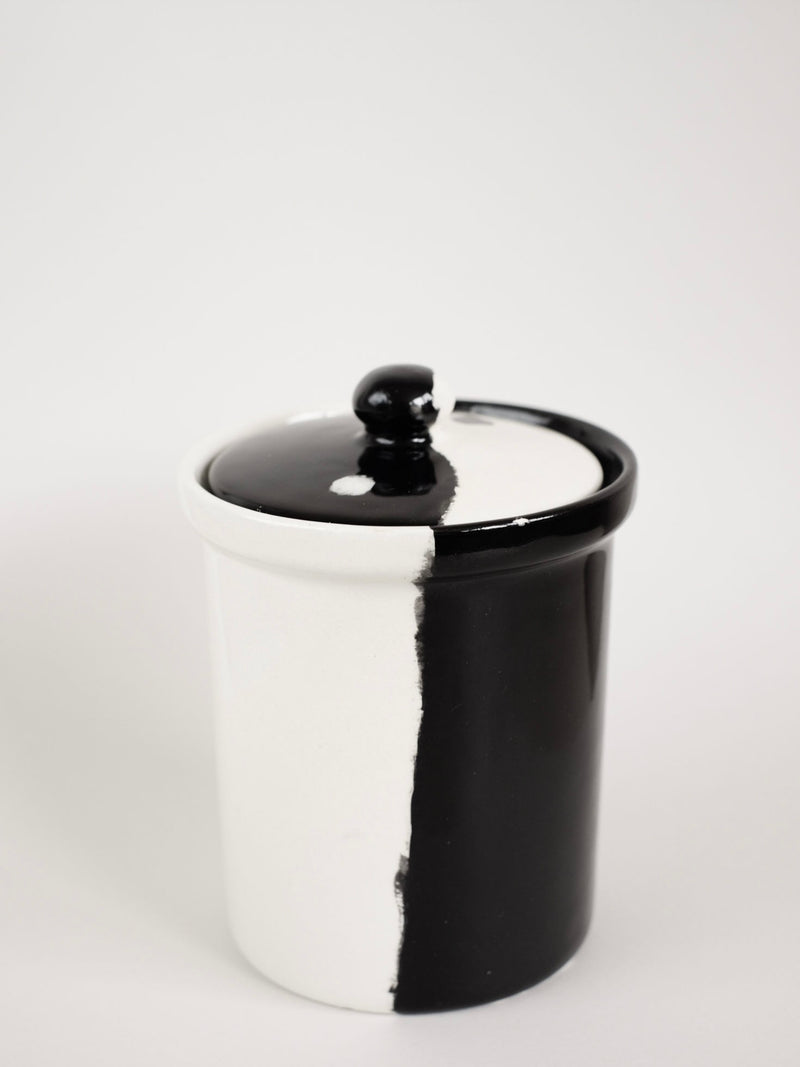 Handmade ceramic jar with black and white yin-yang design