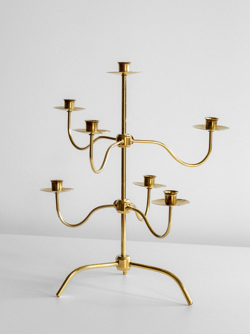 The Spigel Medium Mid-Century Brass Candelabra, featuring eight candle holders arranged on three levels, sits on a white surface against a plain white background. The design, reminiscent of Josef Frank's modern style for Svenskt Tenn, showcases curved arms extending from a central stem.