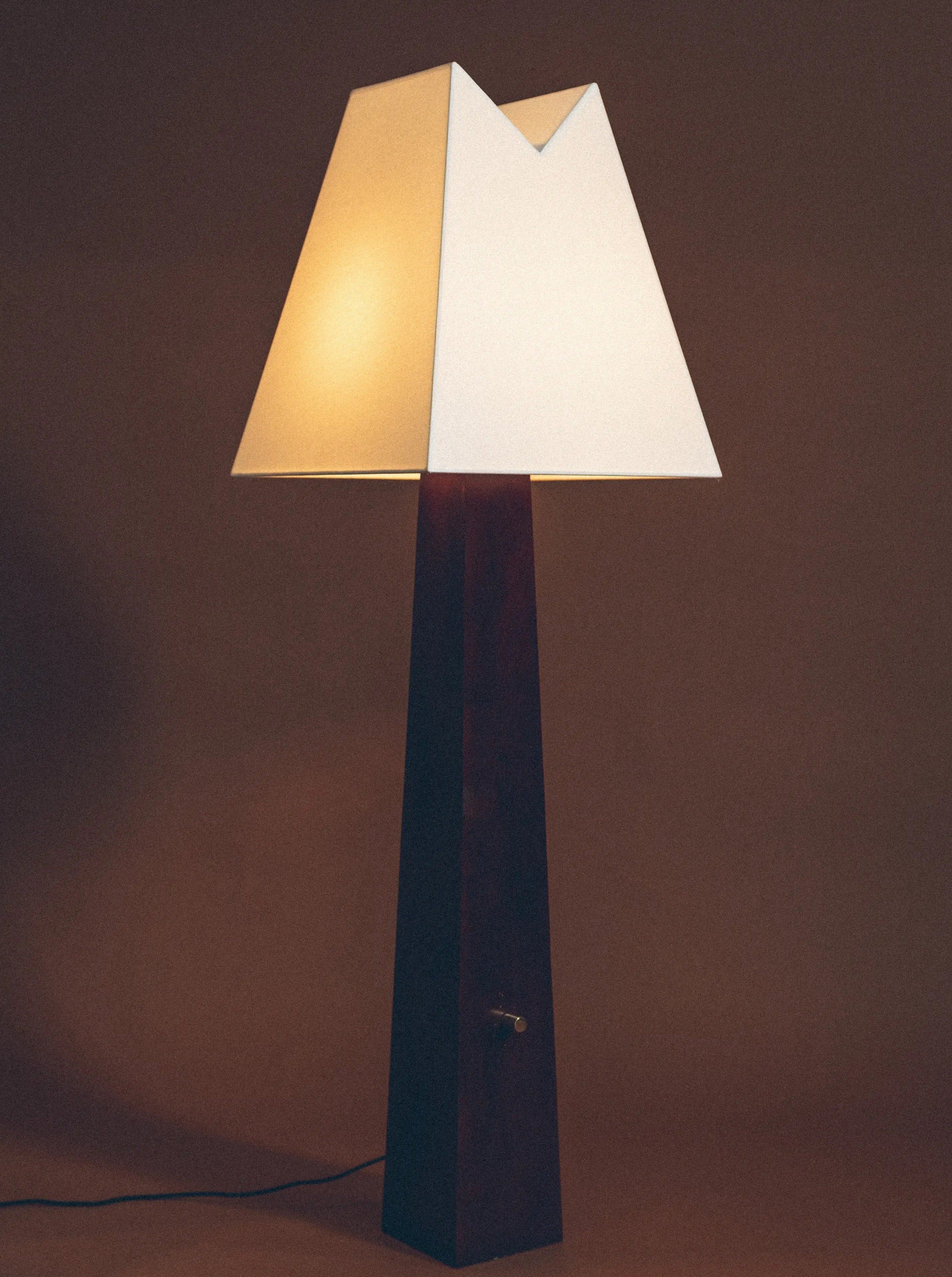 Alpine floor lamp with sleek metal base and adjustable arm