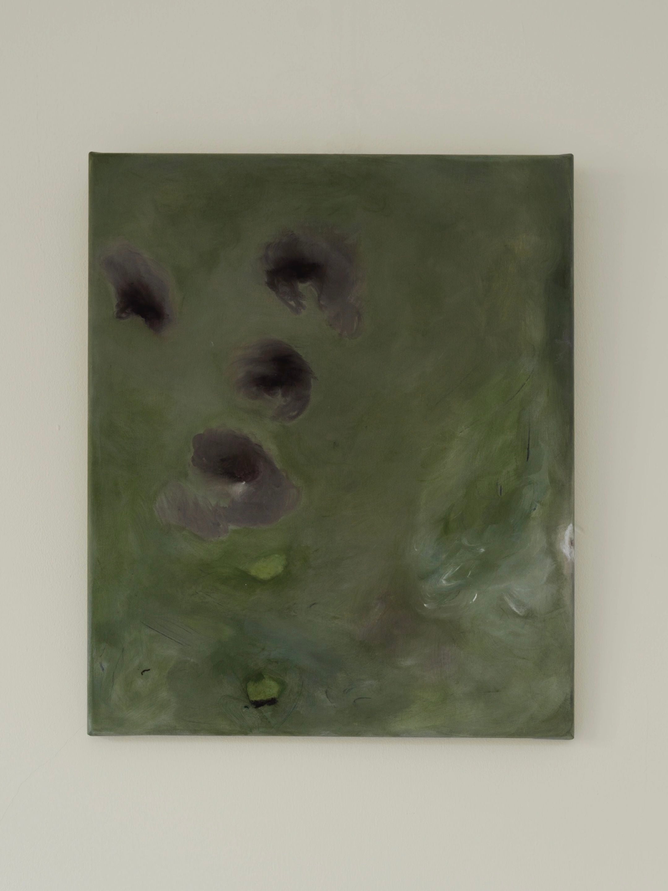 An exclusive artwork by Yeliza Gevorgyan titled "Let go of gravity" showcases dark, irregular shapes on a dark green background. Crafted with natural pigment on fine linen, it exudes a muted and earthy mood.