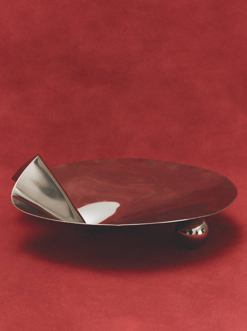 Stainless steel footed serving bowl with decorative rim and polished finish