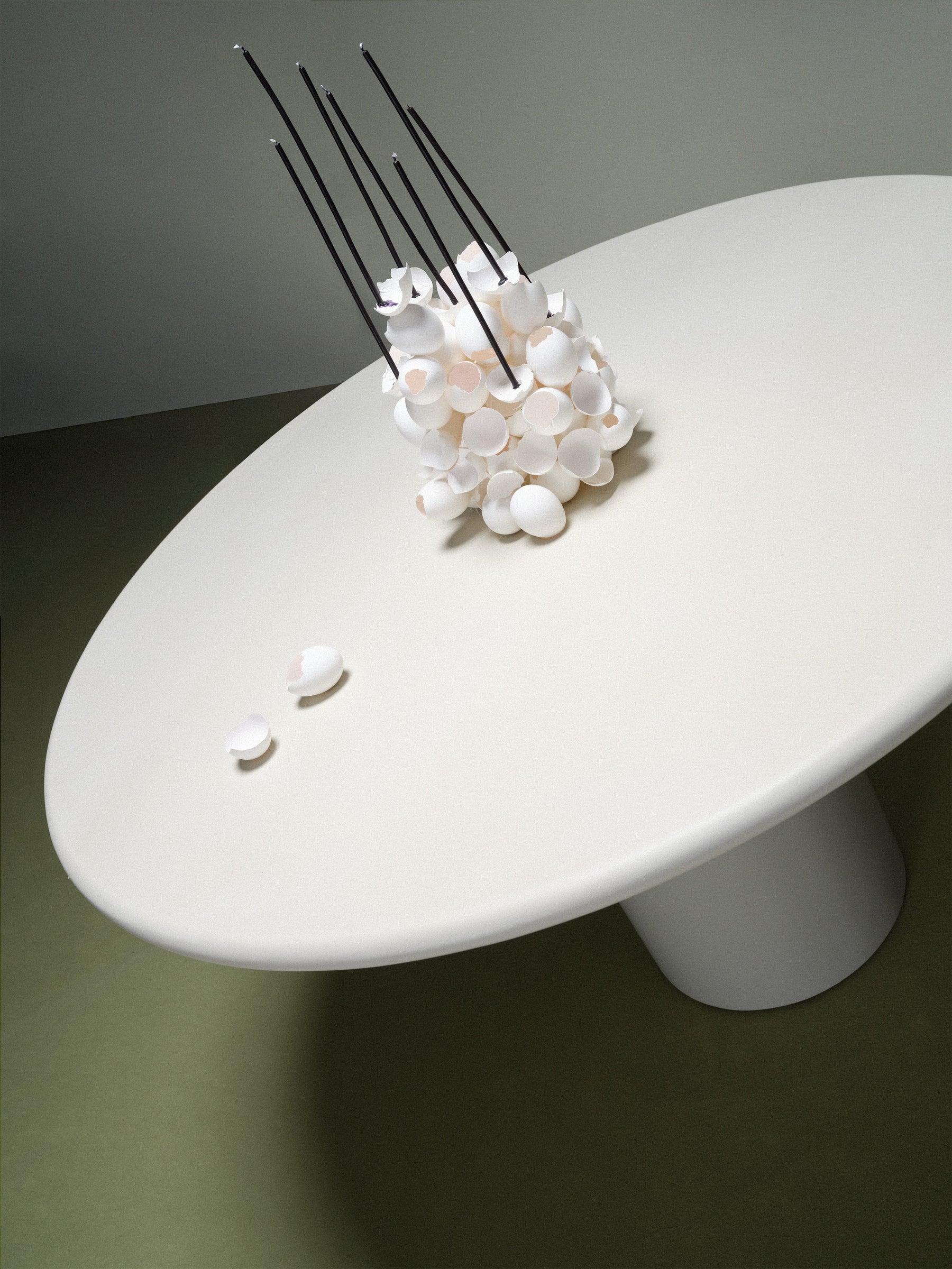 Gio Dining Table — top view of white surface with decorative centerpiece