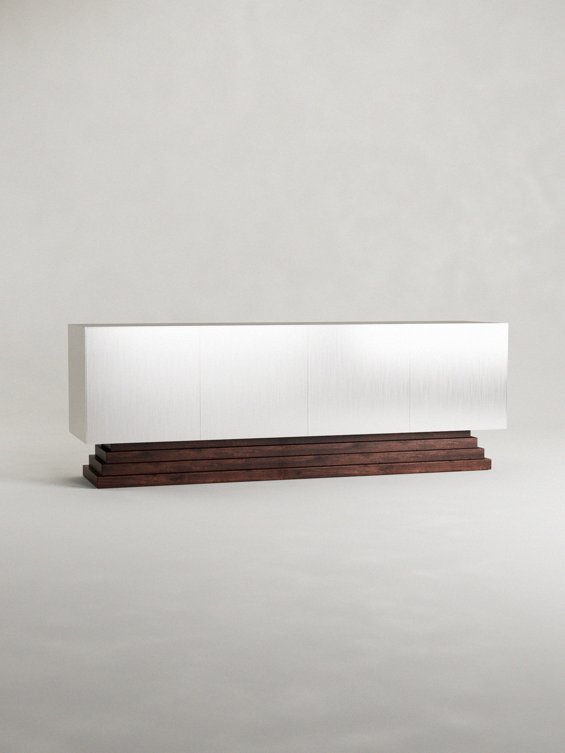 The 'Fragua' sideboard by Siete Studio features a sleek, minimalist design with clean white lines on a walnut base set against a neutral background, showcasing the contrast between its modern aesthetic and rich wood grain craftsmanship.