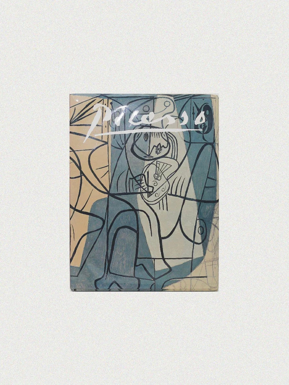 The cover of the "Picasso by Gabriel Potter Vintage Art Book" from Boga Avante Shop features modern art with abstract geometric shapes and human figures. A prominent white signature stands out at the top against a soft palette of beige and blue tones, reminiscent of a Spanish artist like Picasso.