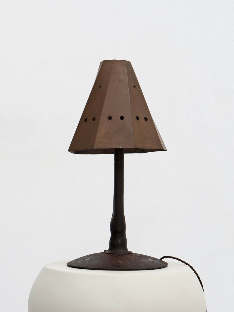 Brutalist tole table lamp with perforated copper shade on dark base