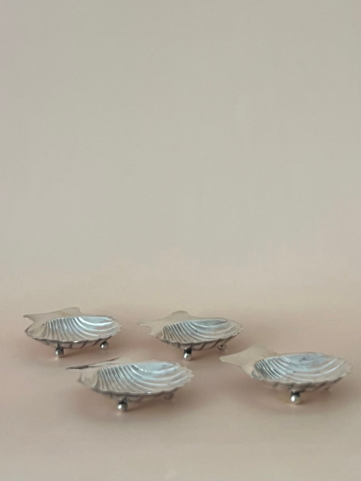 Four Sterling Silver Aperitif Plates
