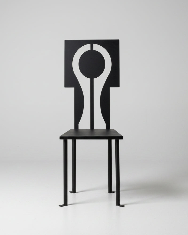 Modern black iron Luna chair with geometric circular backrest cutout