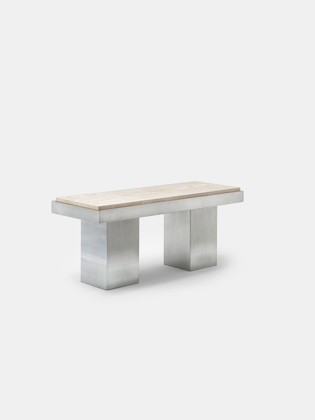 The Console Table 02 by Studio Vraco is a minimalist piece inspired by the Bauhaus movement, showcasing a rectangular light-colored wooden surface. Its design includes sturdy silver metallic legs crafted from brushed stainless steel, all presented against a plain white background.