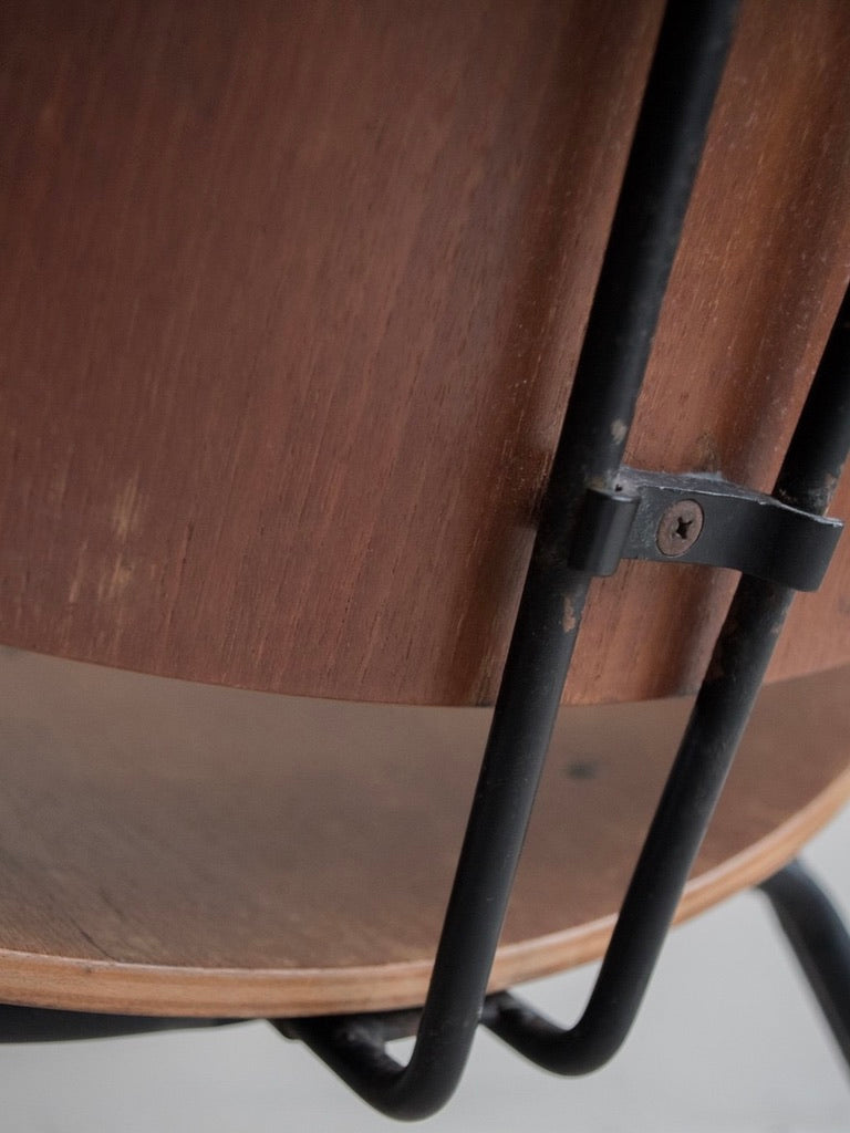 Close-up of the Osvaldo Borsani - P31 by Bicci de' Medici, featuring a natural wood grain drum with a worn, dark metal frame, reminiscent of Italian Mid-Century design. It rests against a neutral backdrop, echoing the elegance associated with Tecno furniture company aesthetics.