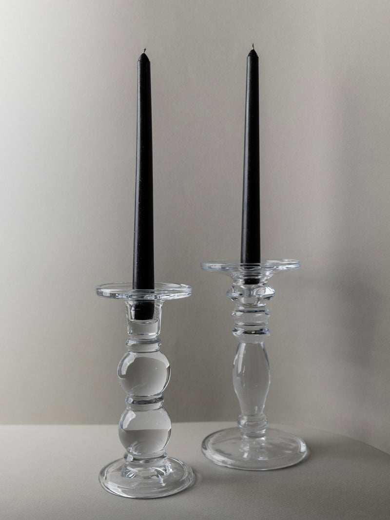 Pair of clear glass candlesticks with black tapers, Italy 1990s