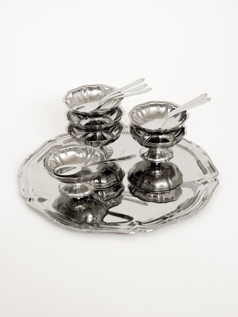 Guy Degrenne polished steel ice cream bowls with spoons on glass tray