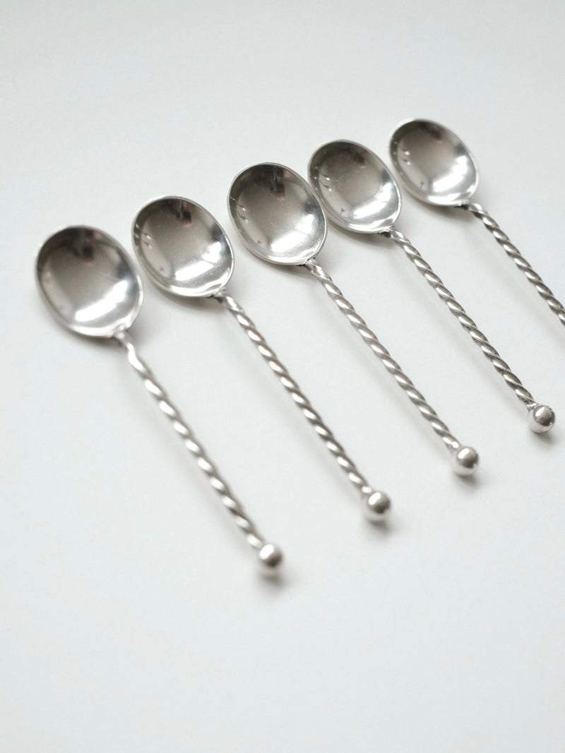 Set of 5 silver-plated spoons with twisted handles detail view