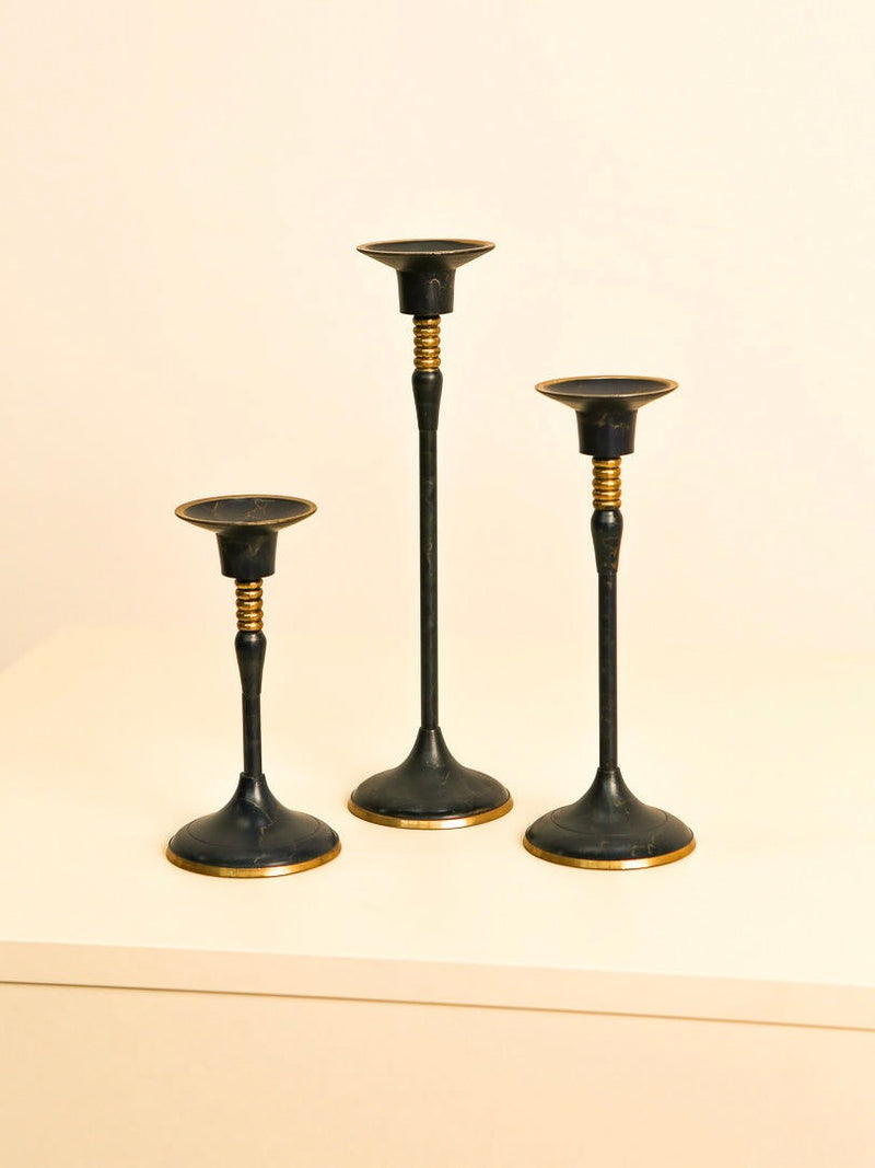 Set of three vintage blue metal candlesticks with gold accents