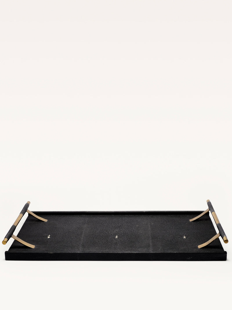 A rectangular Black Shagreen Tray by Galerie MLS, featuring a textured surface and tan foldable handles, is displayed upside down against a plain white background.