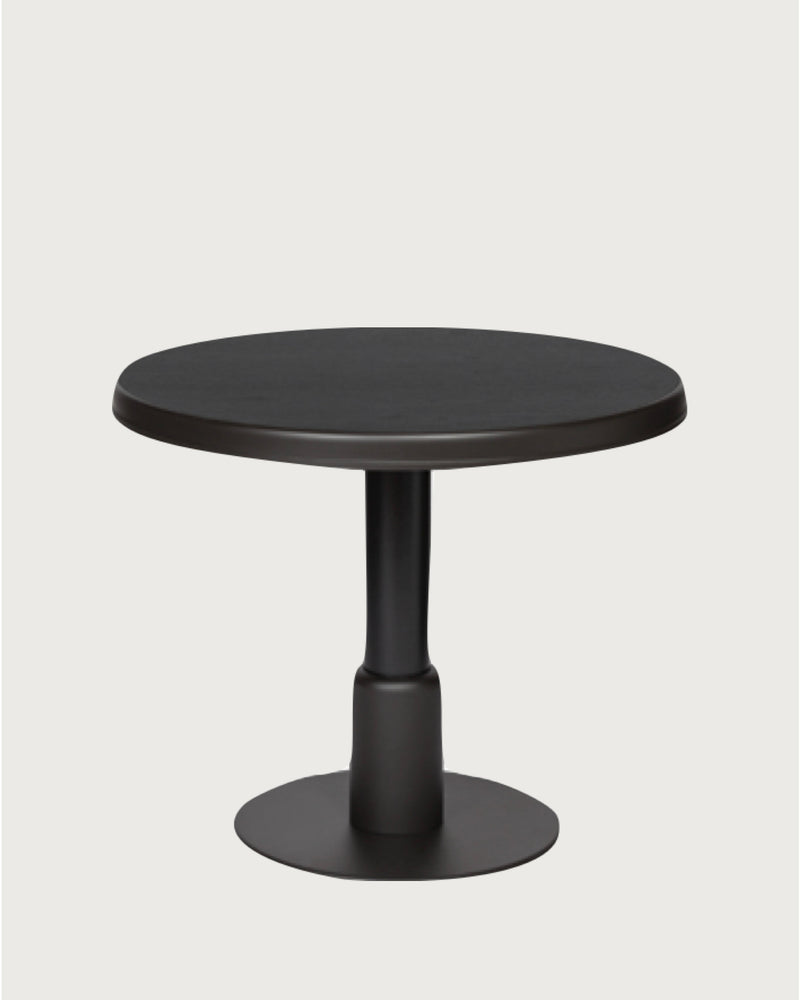 Round black pedestal dining table by Giobagnara
