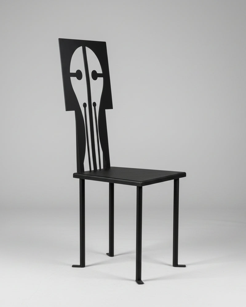 The "Epona" Chair in Iron and Black Powder Coat by Animate Objects showcases a geometric, artistic backrest with abstract cut-outs, offering handcrafted elegance inspired by Istanbul’s style.