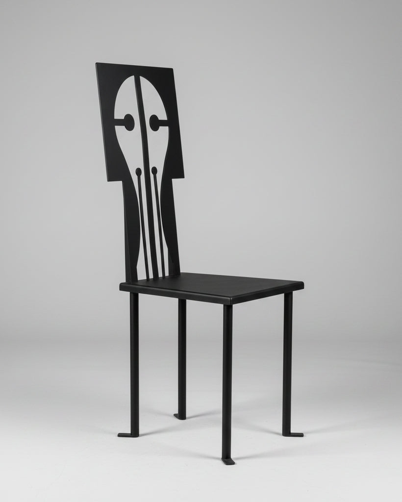 The "Epona" Chair in Iron and Black Powder Coat by Animate Objects showcases a geometric, artistic backrest with abstract cut-outs, offering handcrafted elegance inspired by Istanbul’s style.