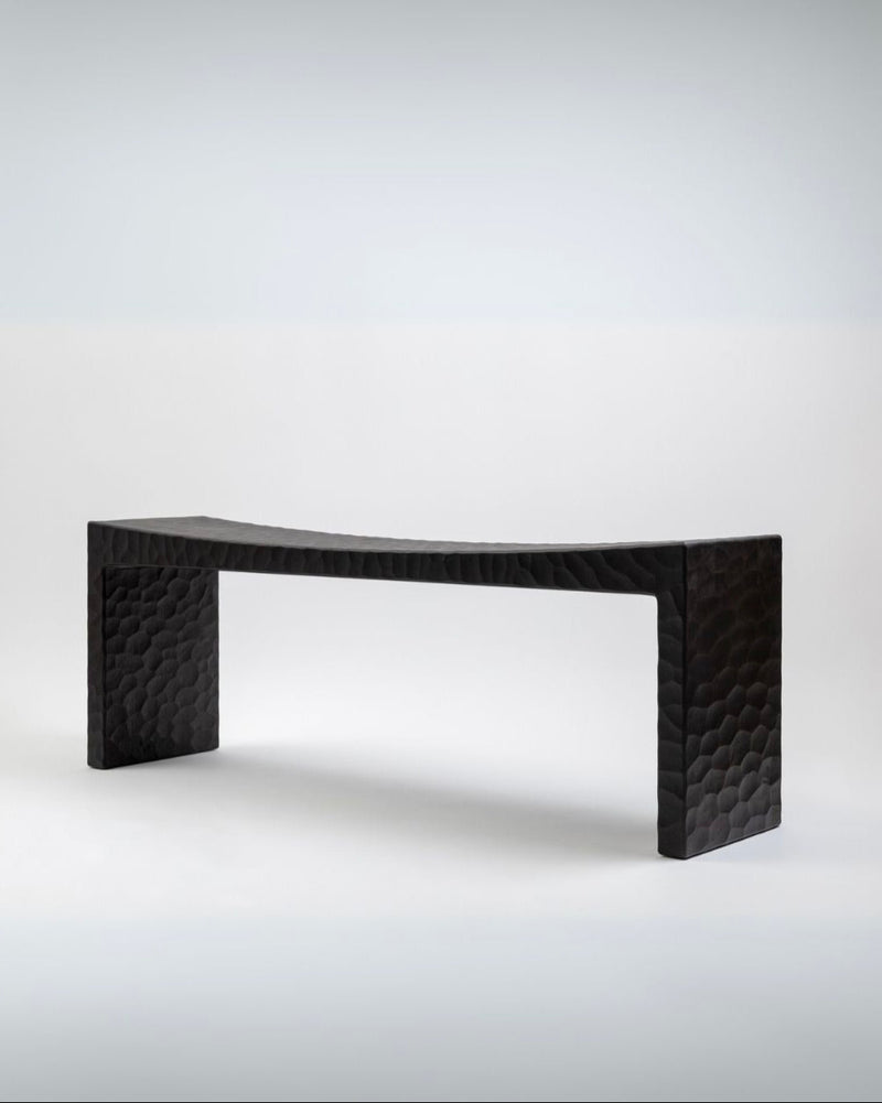 Black textured bench with geometric honeycomb pattern by Giuseppe Rivadossi