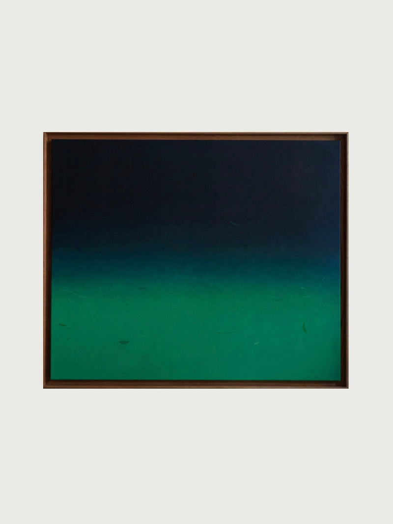 Beneath and Below" by Rebecca von Matérn, a 2024 acrylic painting on canvas, showcases a gradient transition from dark blue at the top to deep green at the bottom against a light gray background. The colors blend smoothly within a shadow frame of hard waxed oak, creating a tranquil and serene effect.