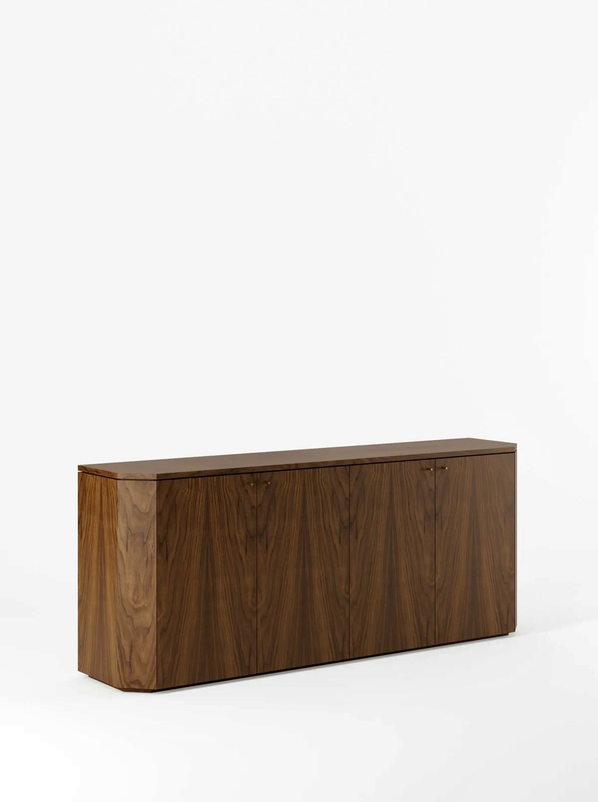 With a minimalist design and crafted by Lemon, the Winston Server in Walnut is a rectangular wooden sideboard featuring a rich, dark wood finish and four vertically aligned cabinet doors. It sits on a flat base against a plain white background, highlighting its sleek and modern design craftsmanship.