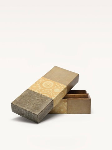 Opened shagreen box revealing interior compartments and textures