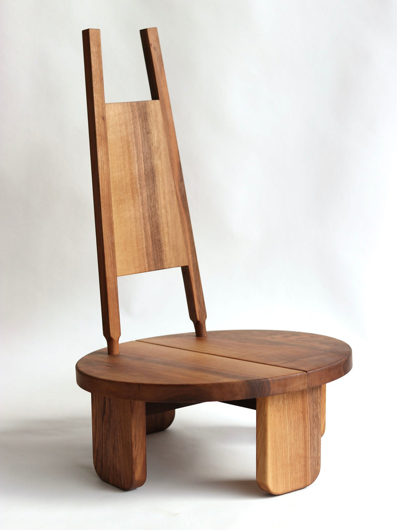 Wilson walnut chair with high backrest and round seat by Eloi Schultz