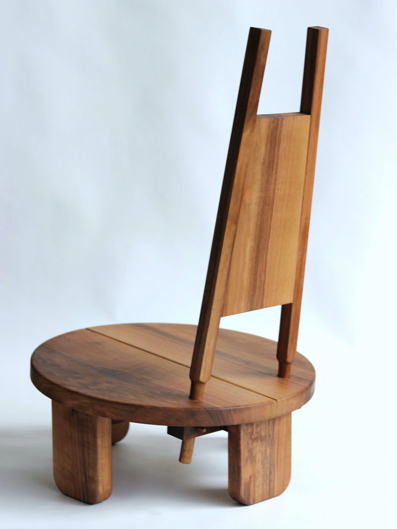 Wilson walnut chair with circular seat and distinctive backrest detail