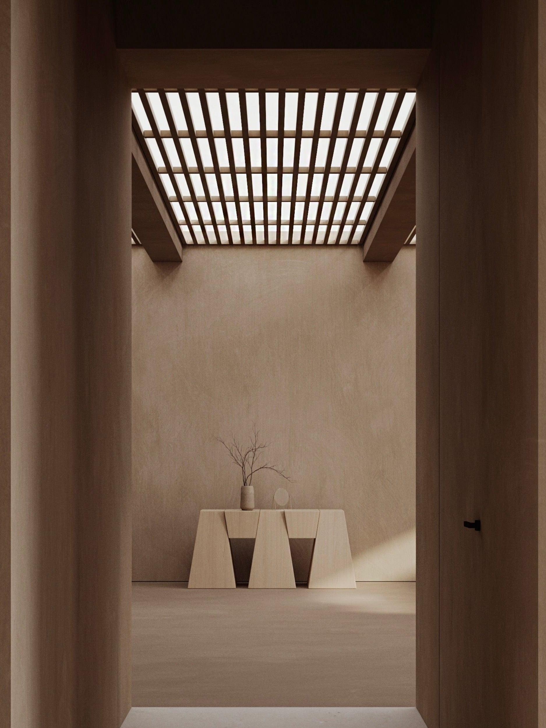 A minimalist room with earthy tones features a wooden wall and a grid-patterned ceiling. Two geometric tables reflect inverse geometry design, one bearing the Monolith M_006 Walnut Console with a bare branch in its vase, casting soft shadows on the wall.