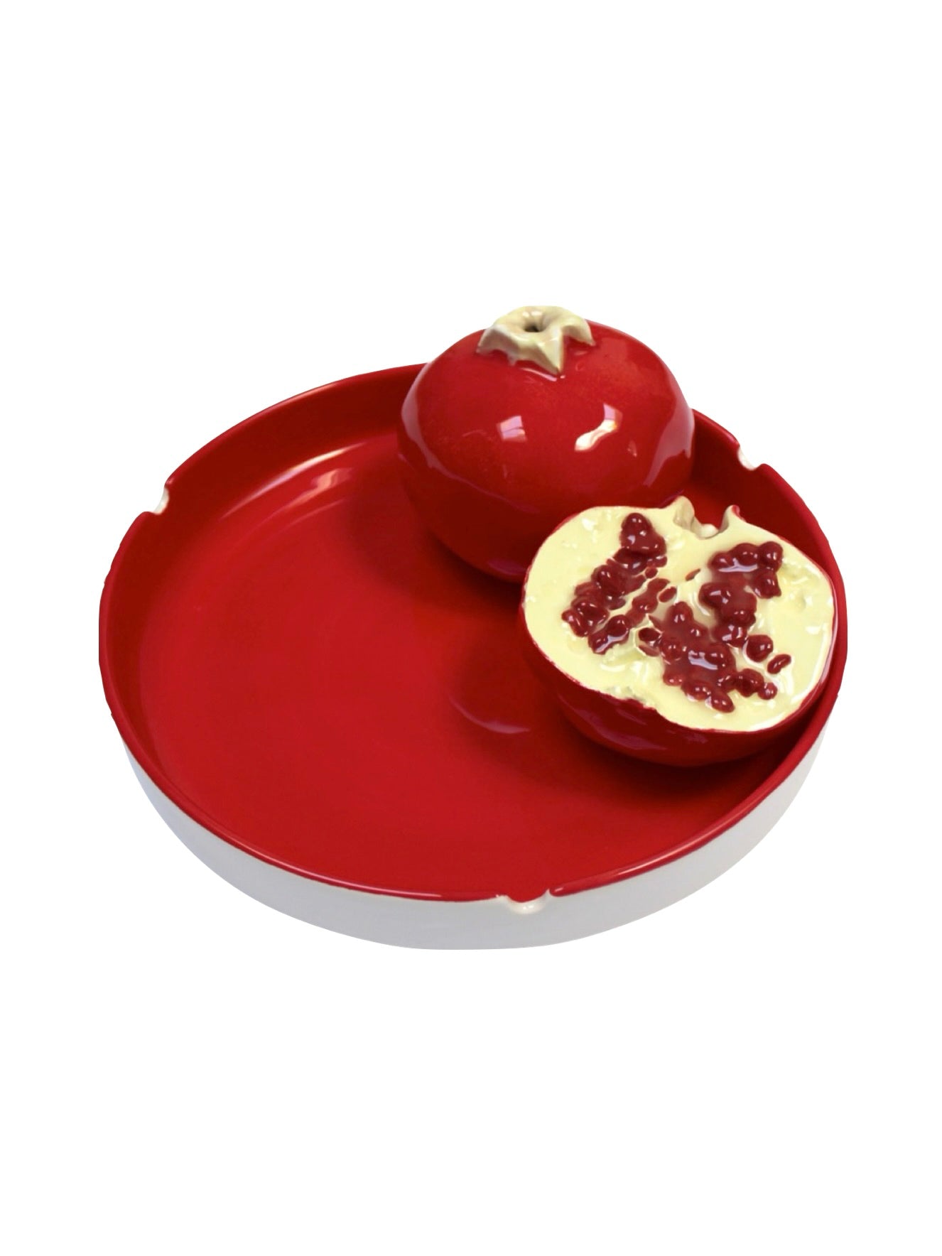 The "Grenades Ashtray" by Villa Arev is a high-quality ceramic dish adorned with two pomegranate-shaped objects—one closed and the other revealing ceramic seeds inside. This beautifully painted earthenware features a glossy finish, infusing Mediterranean charm into any decorative setup.