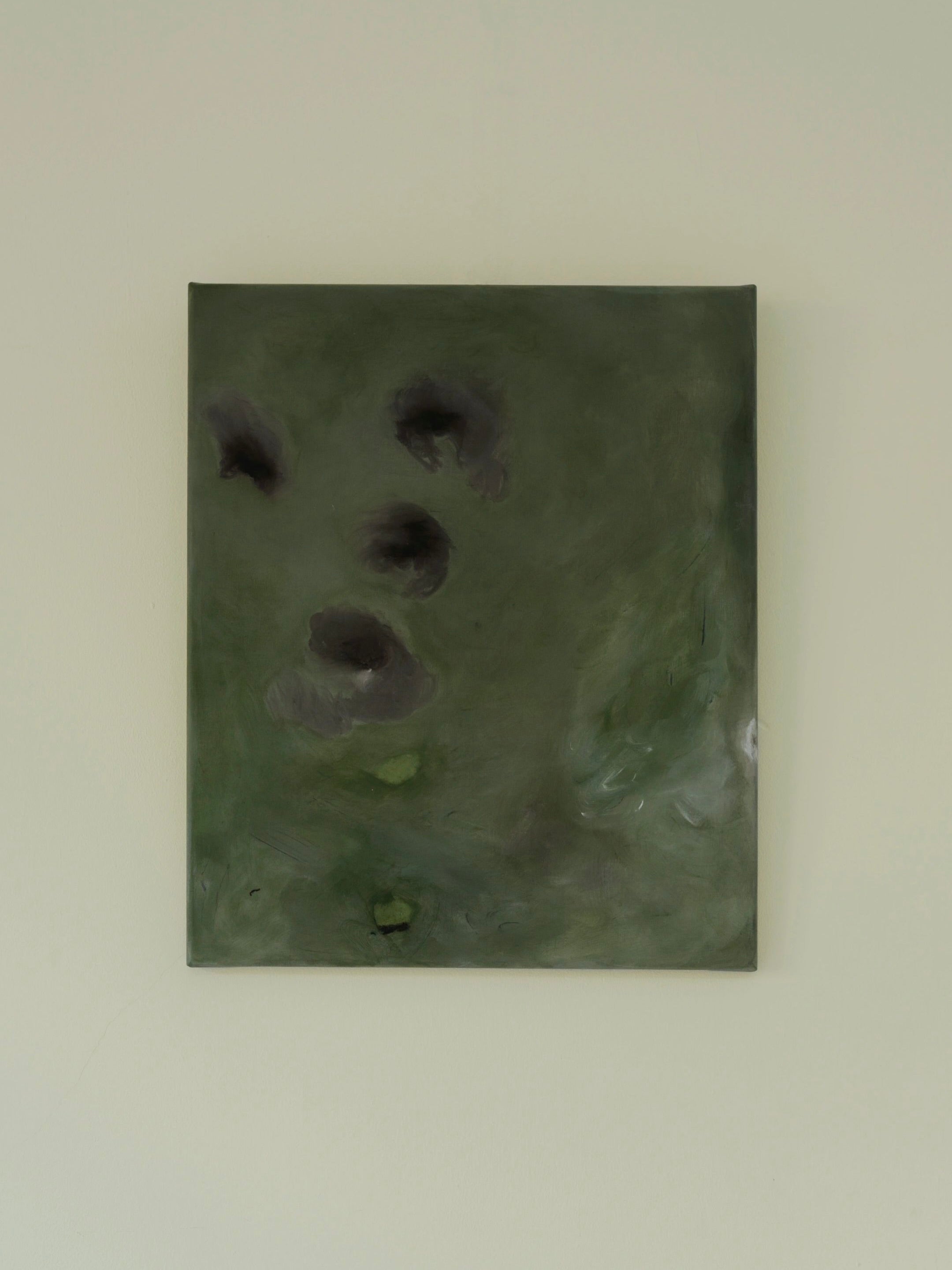 The "Let go of gravity" painting by Yeliza Gevorgyan showcases an original artwork with abstract dark shapes set against a green background, crafted with natural pigment on linen and elegantly mounted on a pale wall.