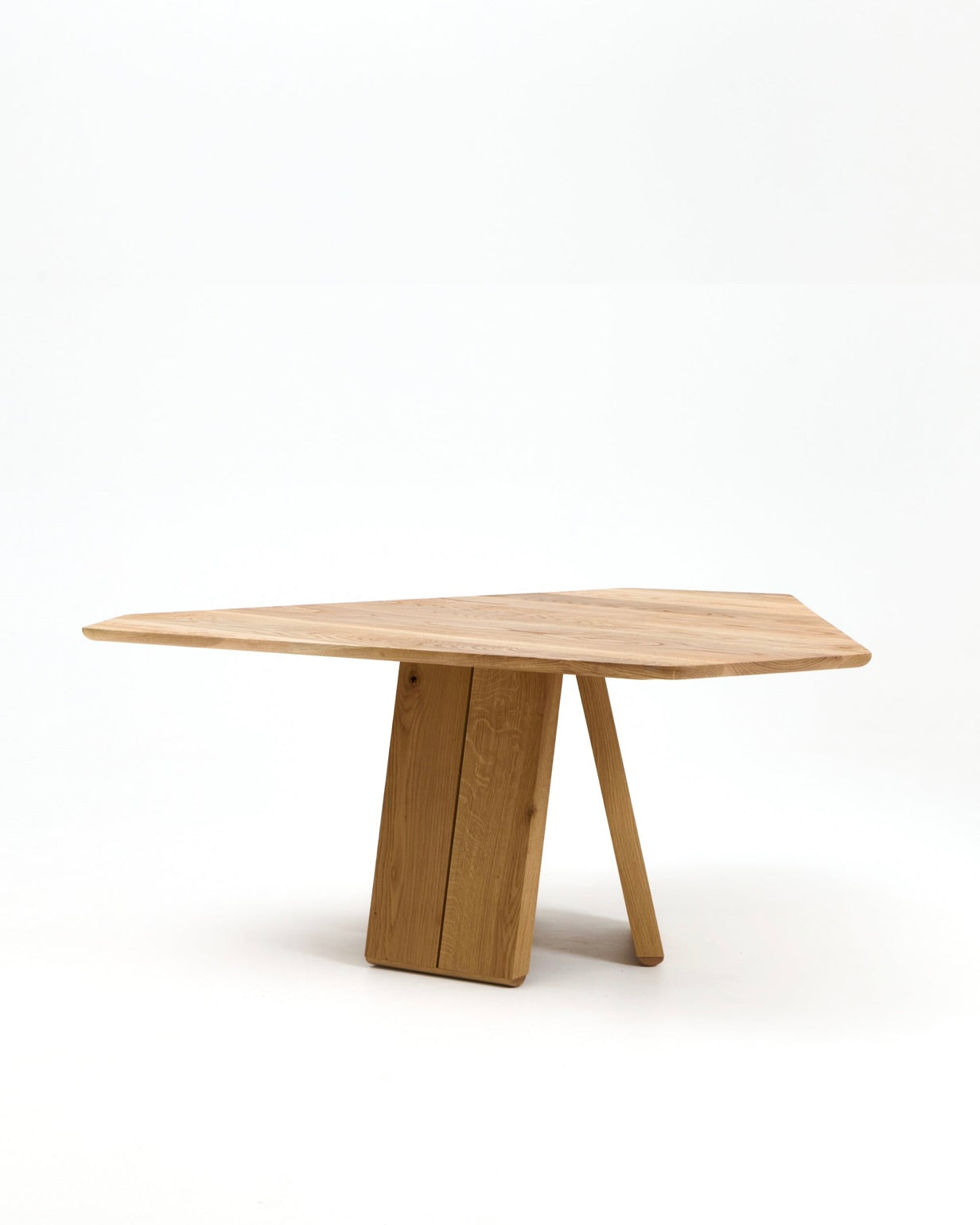 Modern wooden dining table with angular pedestal base and live edge top