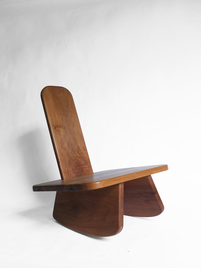 Modern walnut wooden chair with curved backrest by Eloi Schultz