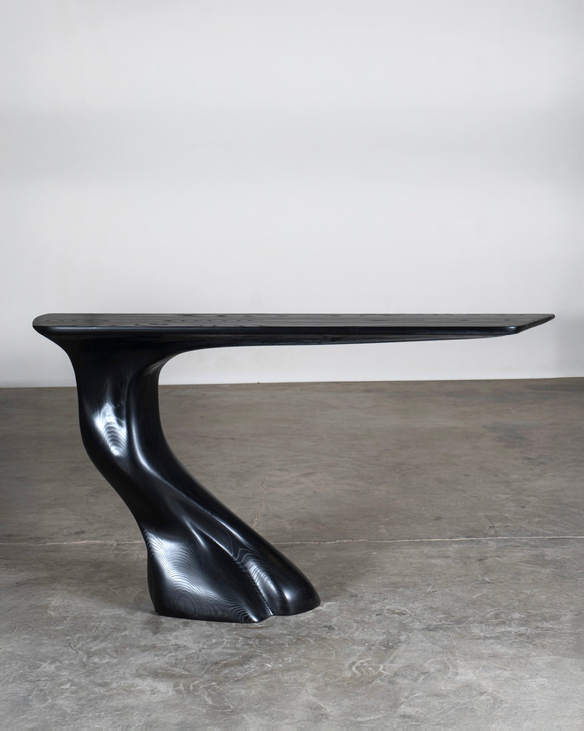 Wood and Walnut Table - Frolic Contemporary — side view of sculptural black wood base