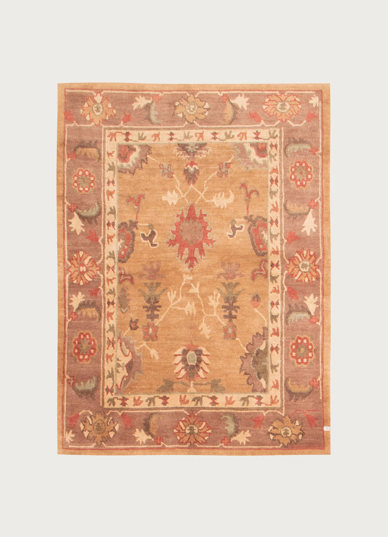 Tibetan Himalaya rug with geometric florals in warm earth tones