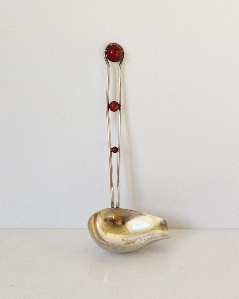 Silver plated serving ladle with amber cabochon handle accents