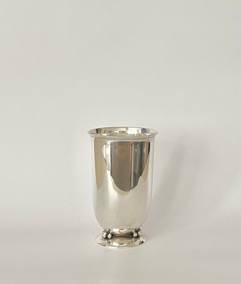 The Art Deco Silver Vase 1940s by Médecine features a smooth, shiny surface and round base, displayed on a light background and evoking classic Scandinavian style.
