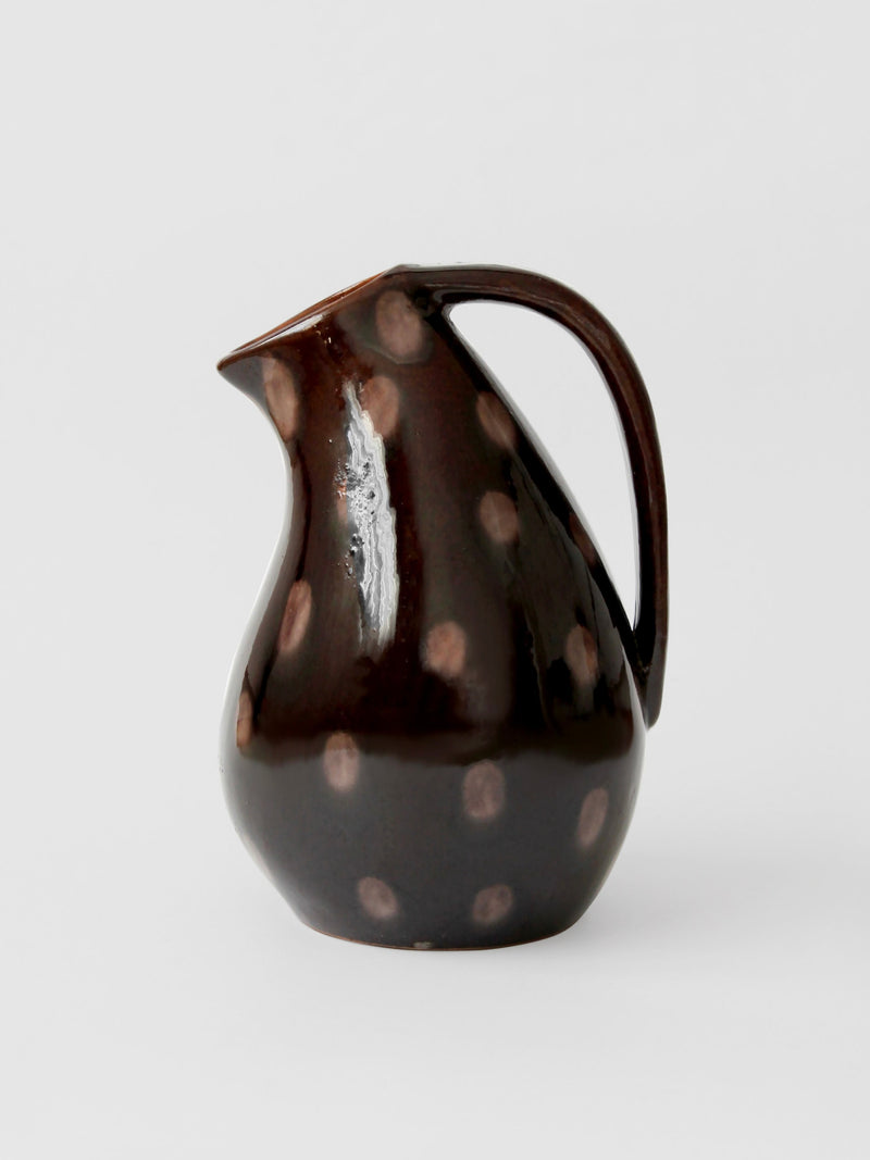 Vintage brown ceramic dotted jug with elegant curved handle