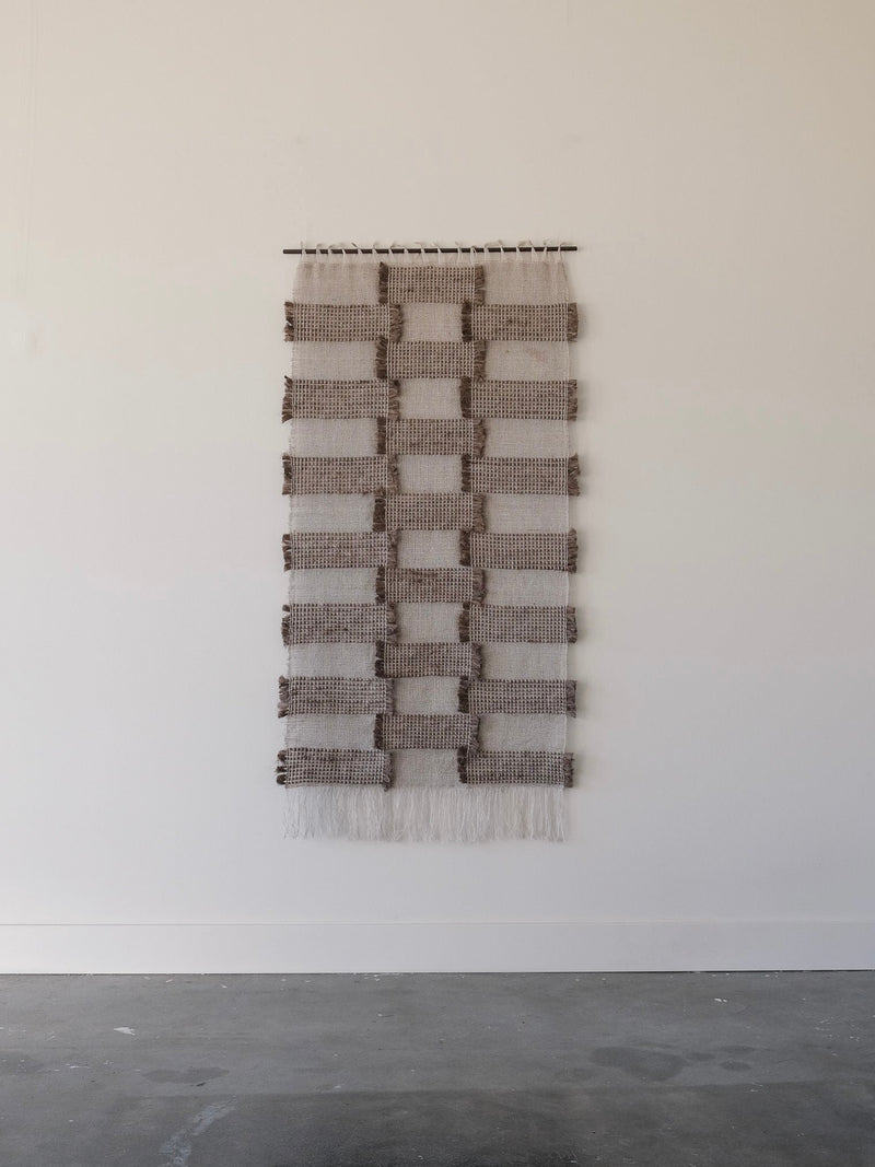Handwoven Check textile wall hanging with geometric pattern detail