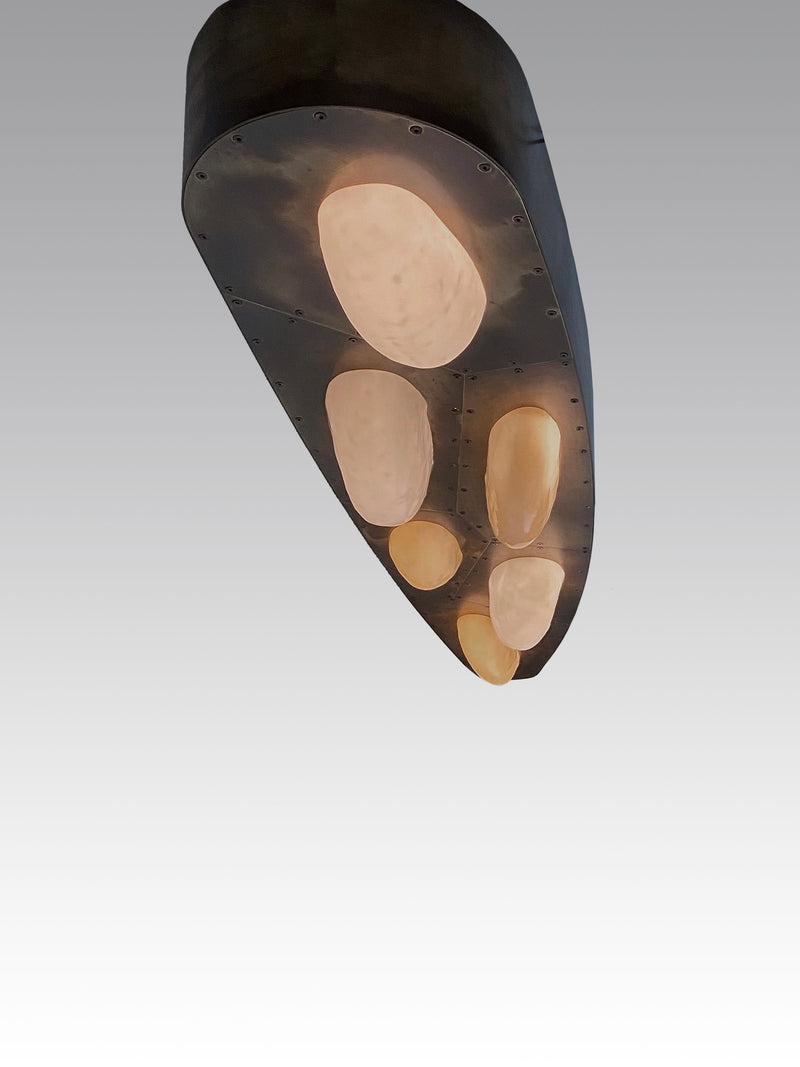 Bubbles Curved chandelier viewed from below showing illuminated oval panels