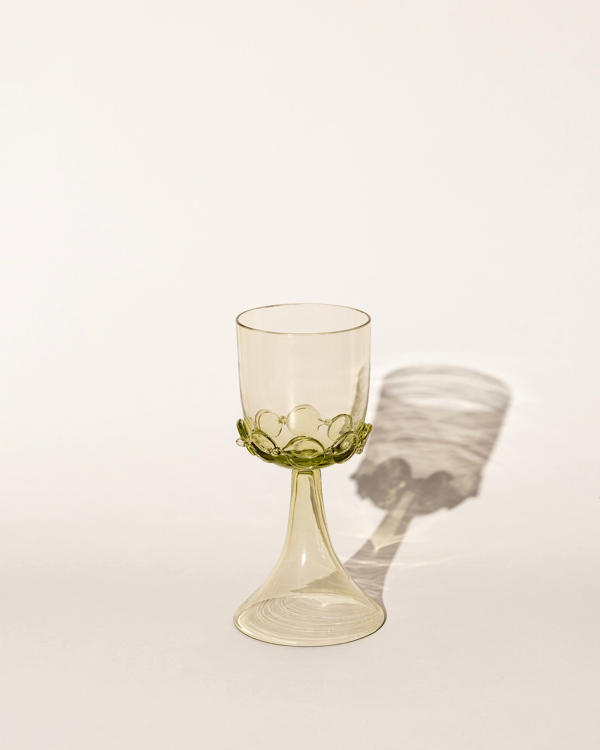 Mouthblown wine goblets with delicate chain design on the stem