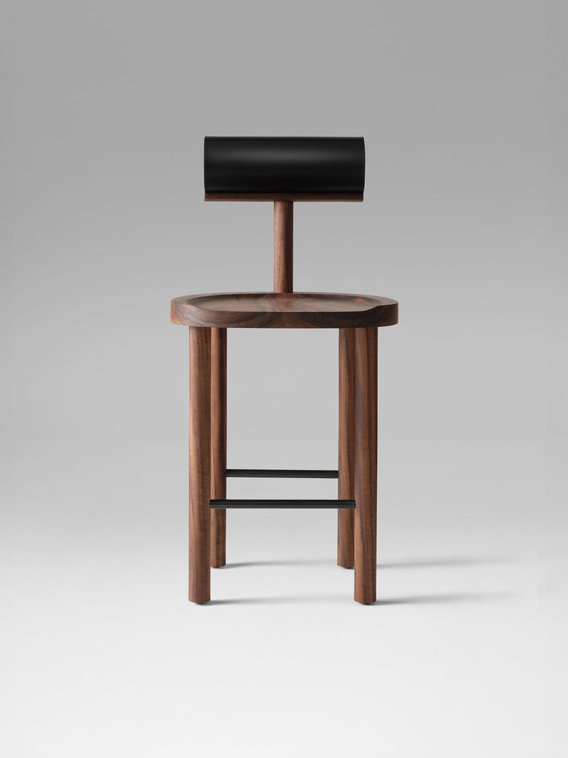 UNA counter stool with walnut frame and black leather backrest